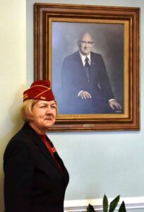 American Legion National Commander Denise Rohan with Roy E. Stone, Jr.'s portrait.